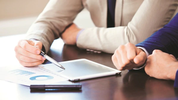 Two people going over a document together