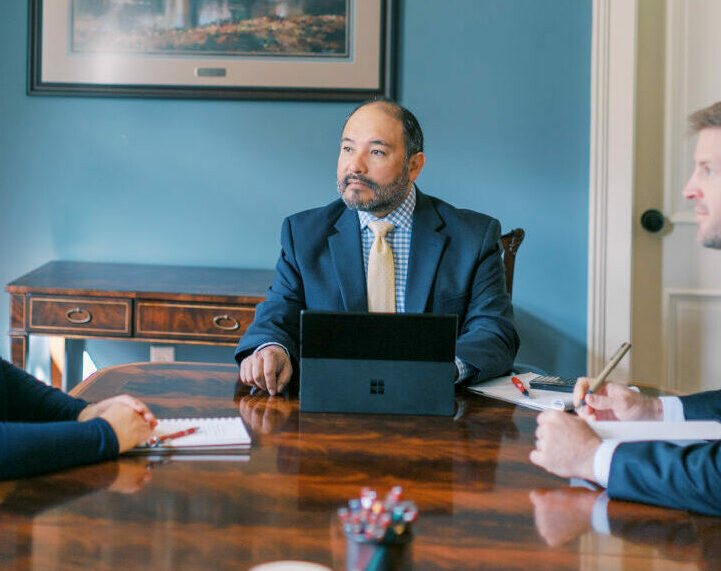 The Good Wealth team sitting around a table